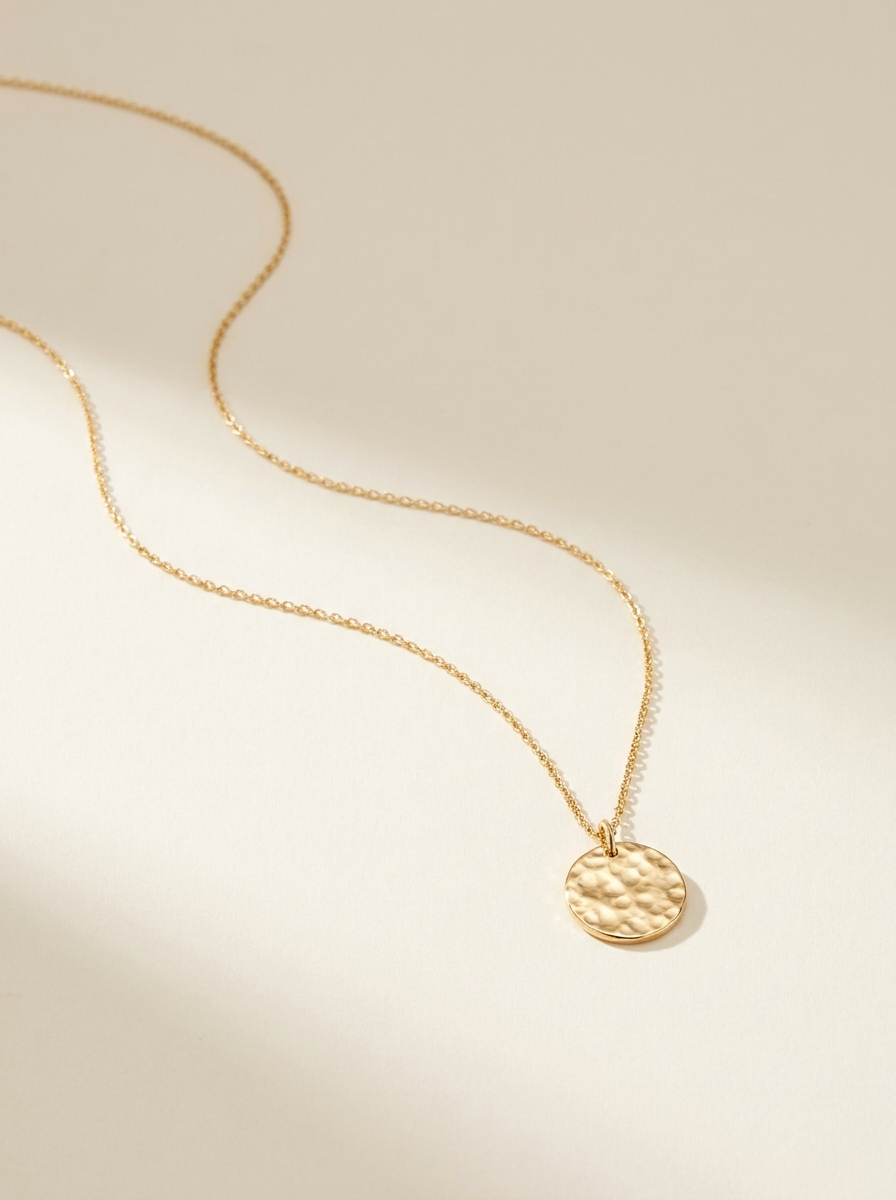 Delicate gold necklace with coin pendant